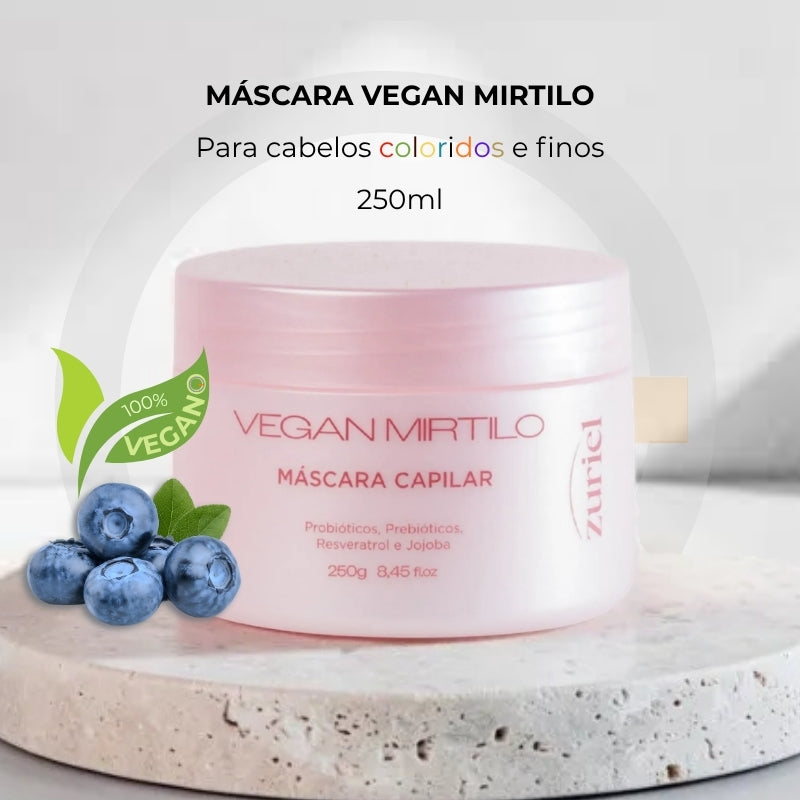 Pote rosa da máscara capilar Vegan Mirtilo, com mirtilos ao lado e indicação de fórmula 100% vegana para cabelos coloridos e finos.