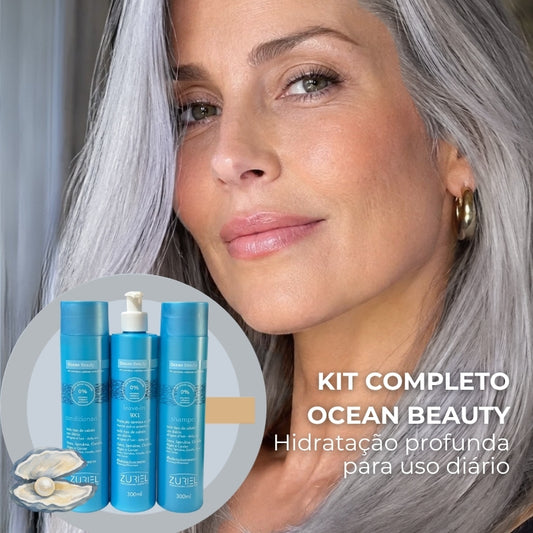 Mulher grisalha e Kit completo Ocean Beauty, hidratação profunda para uso diário. Shampoo, Condicionador e Leave-in. Na loja conceito Orgulho Gray, focada em mulheres grisalhas e em transição para o grisalho.